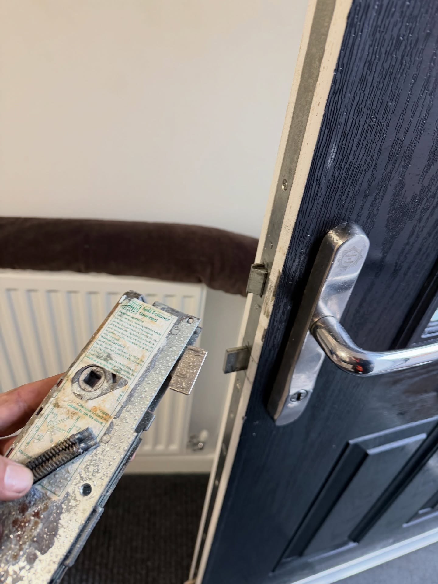 Faulty Winkhaus gearbox shown in hand with broken springs