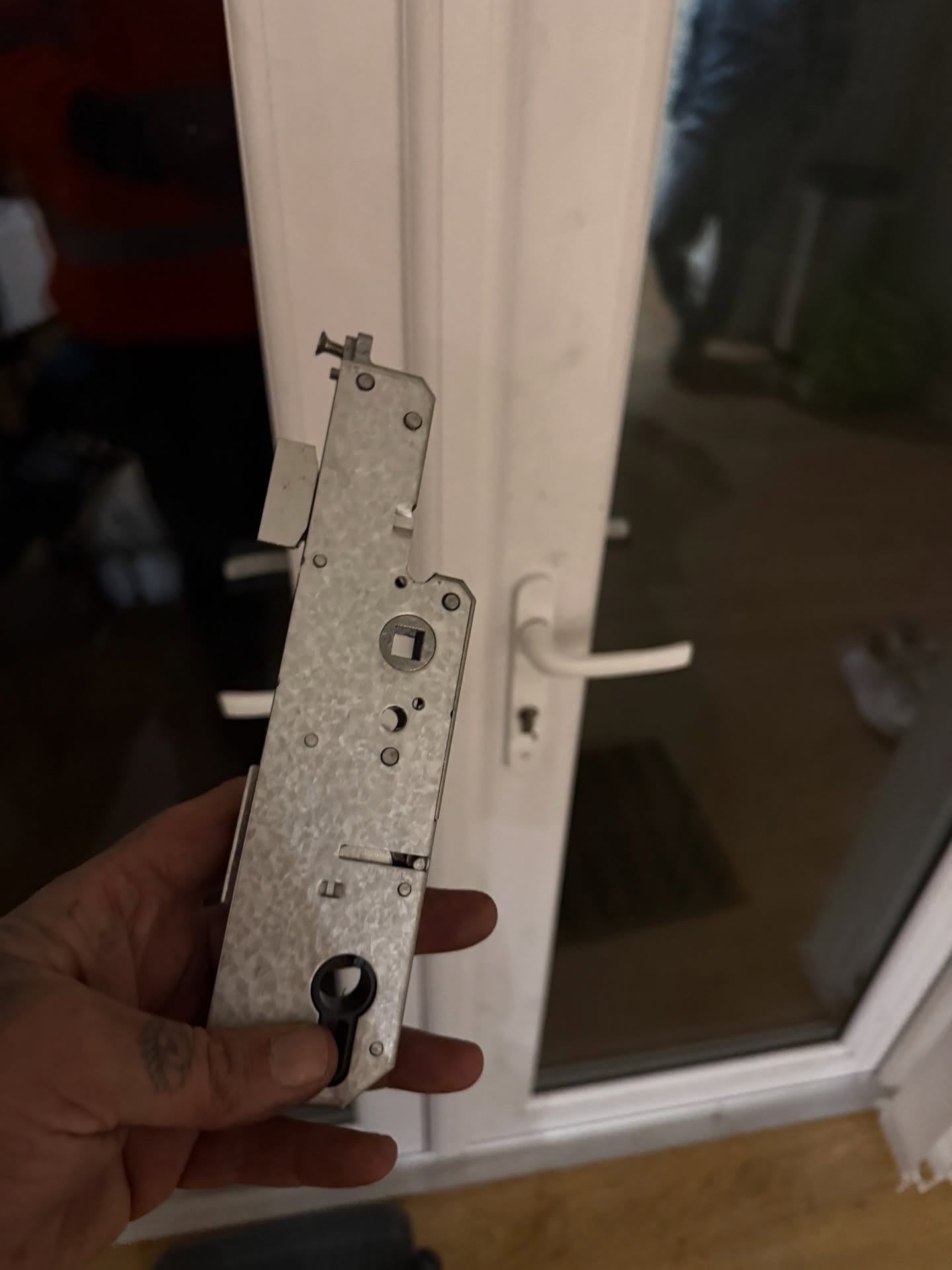 Mila Evolution cntre case being held up in front of newly repaired door