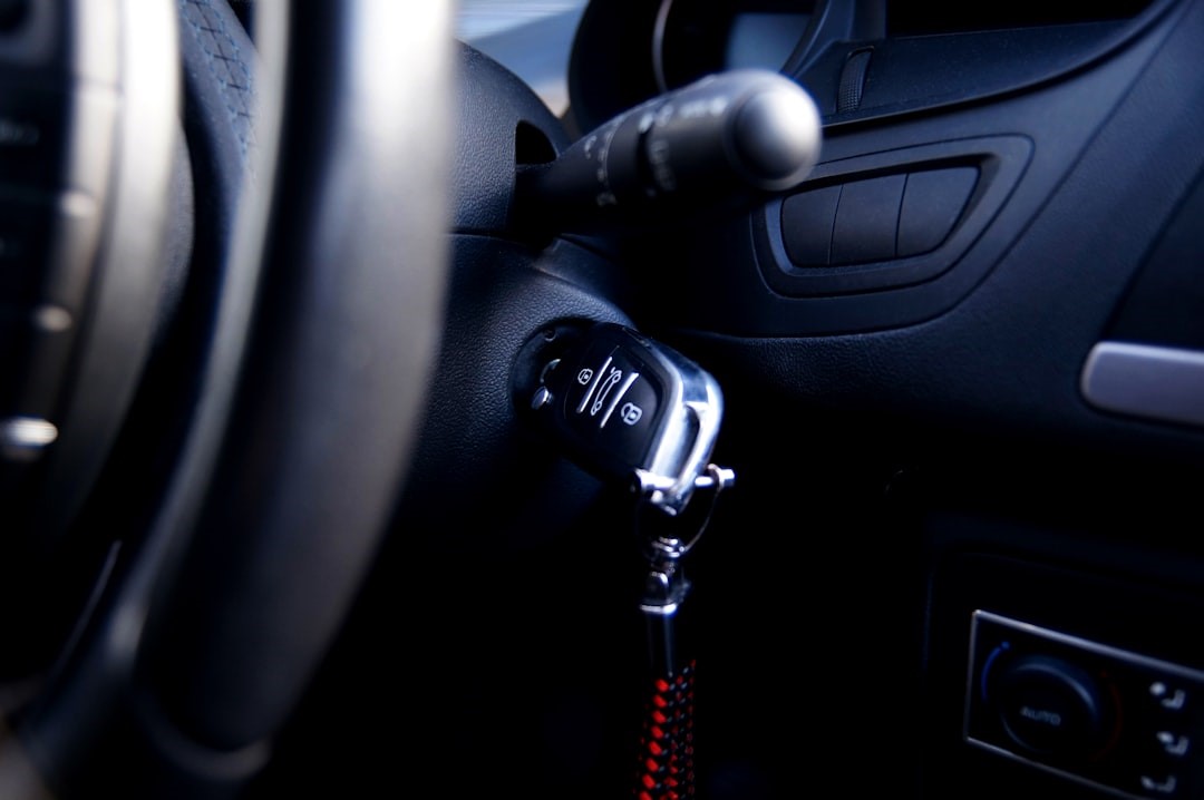 Black and silver transponder key inserted into ignition barrel 