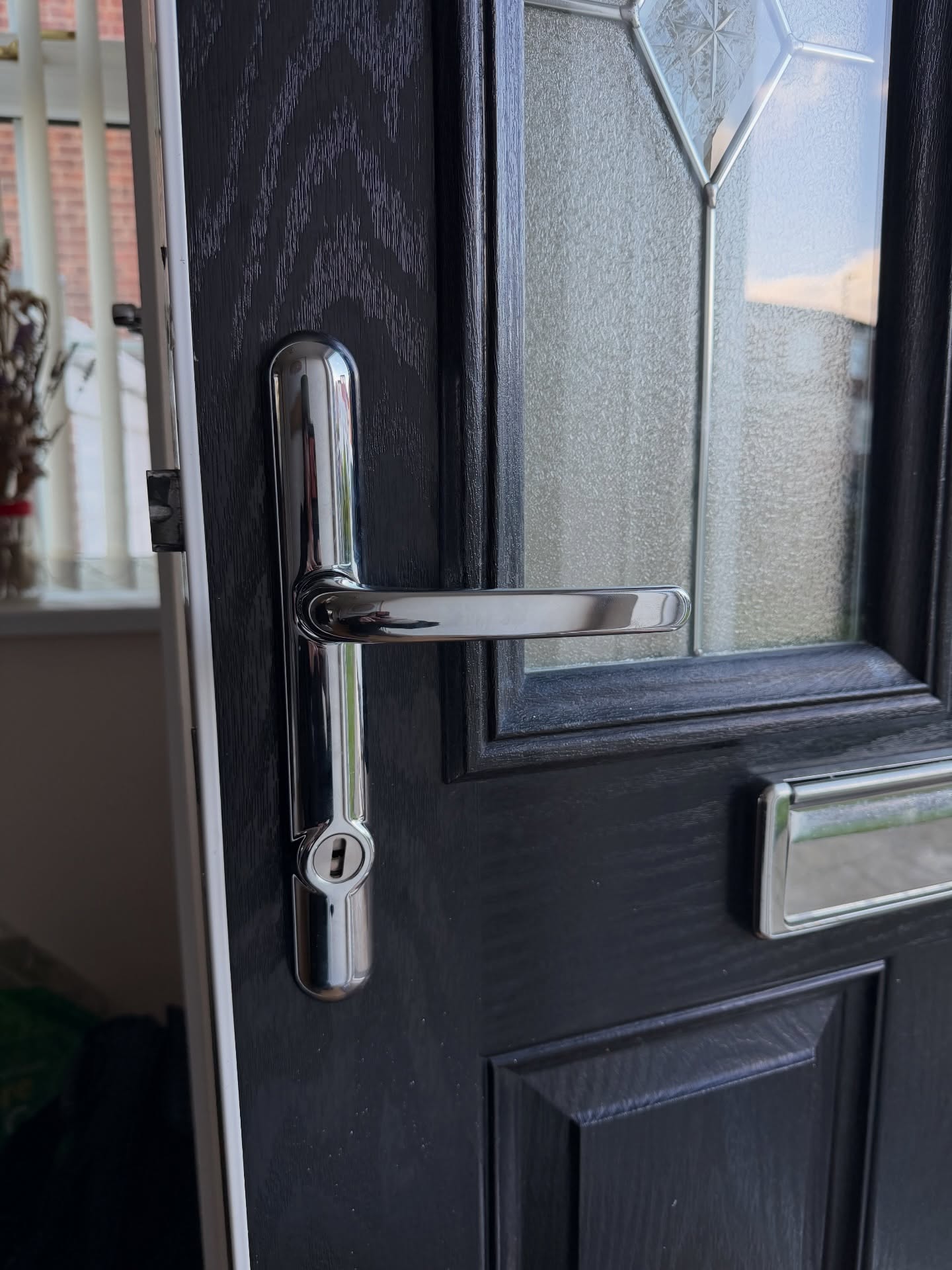 2 star handle and 3 star euro lock in chrome fitted to black composite door 