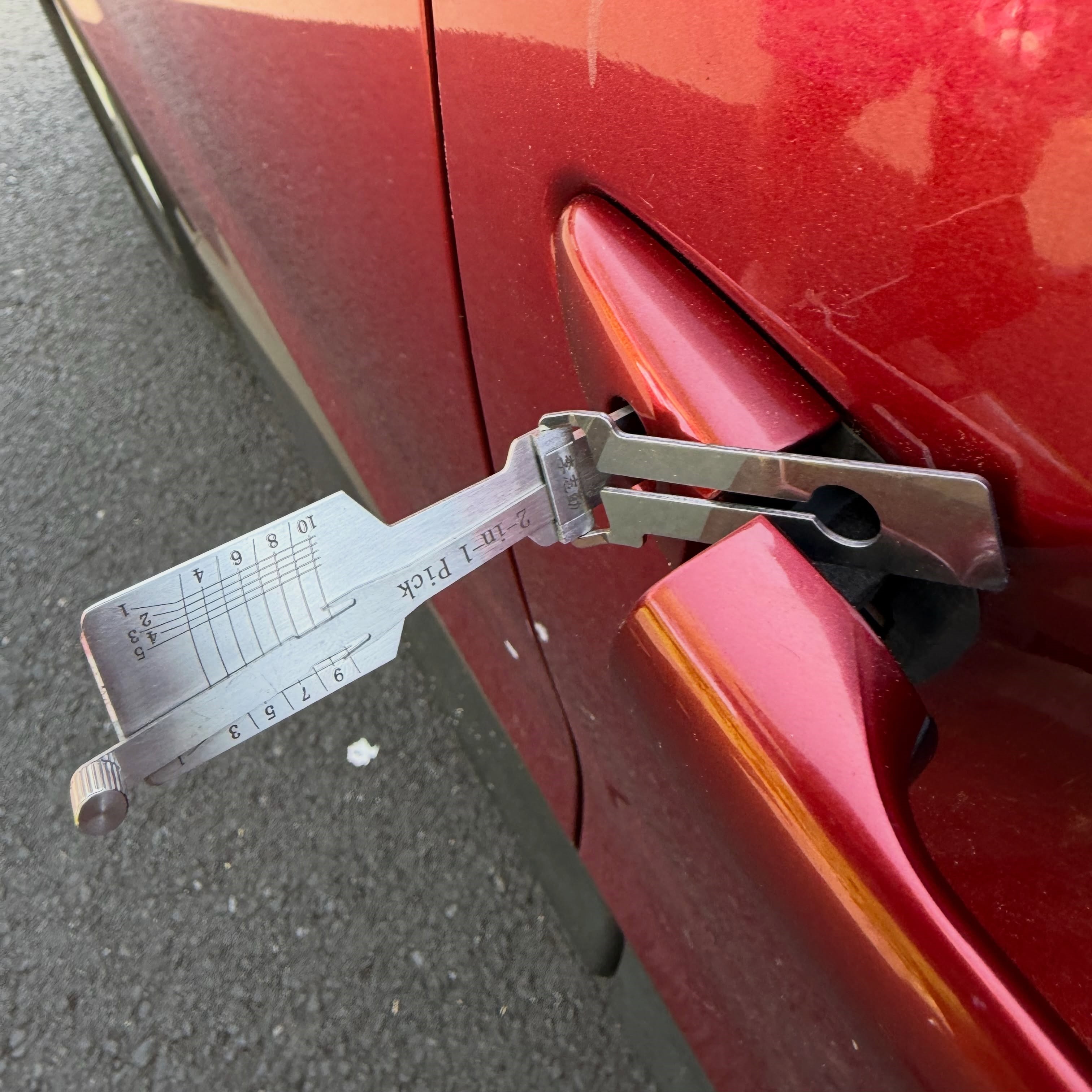 Red Vauxhall Astra car door lock picked open in Shiremoor car park