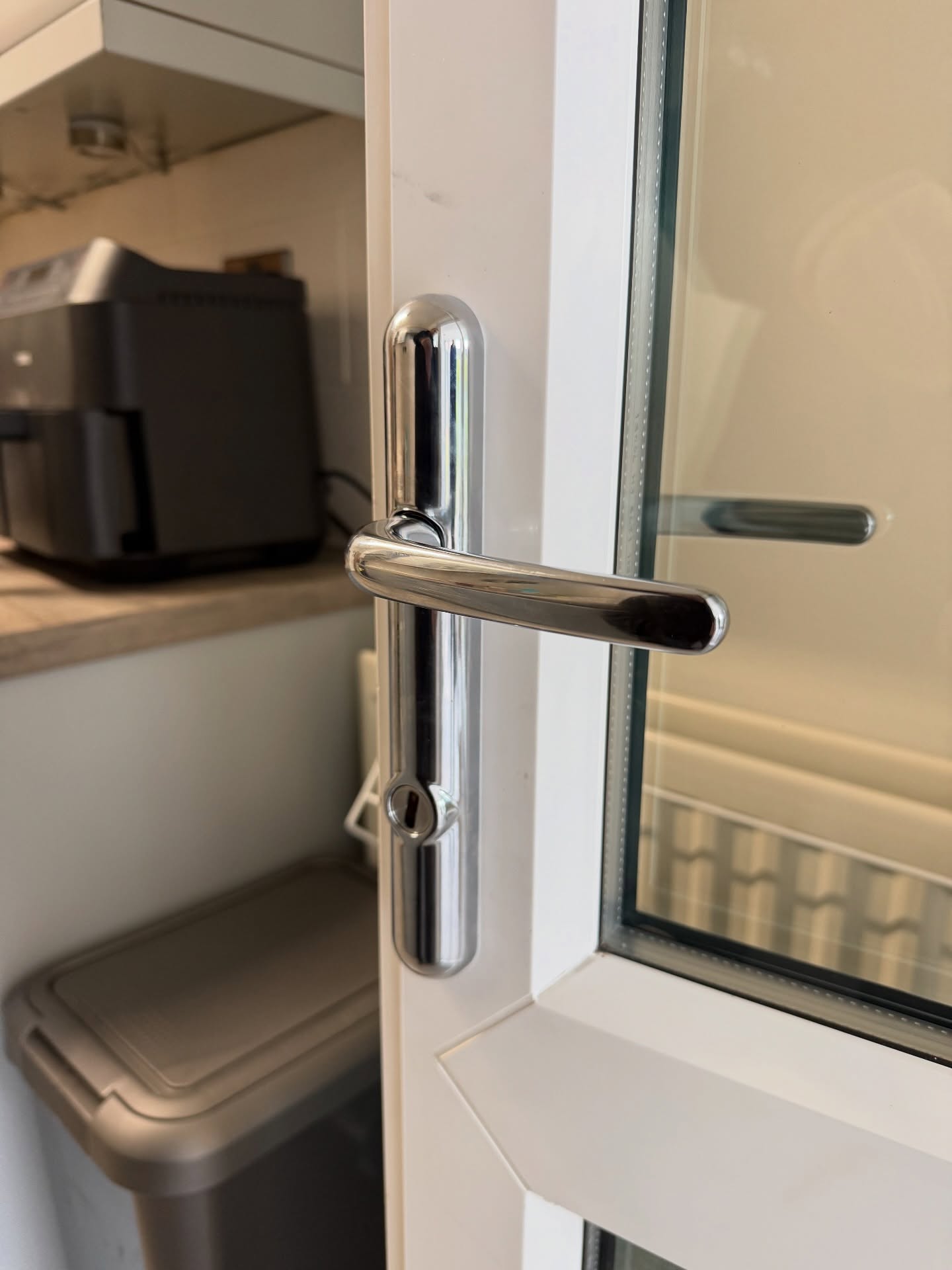 Chrome 2 star high security handle fitted to white upvc door
