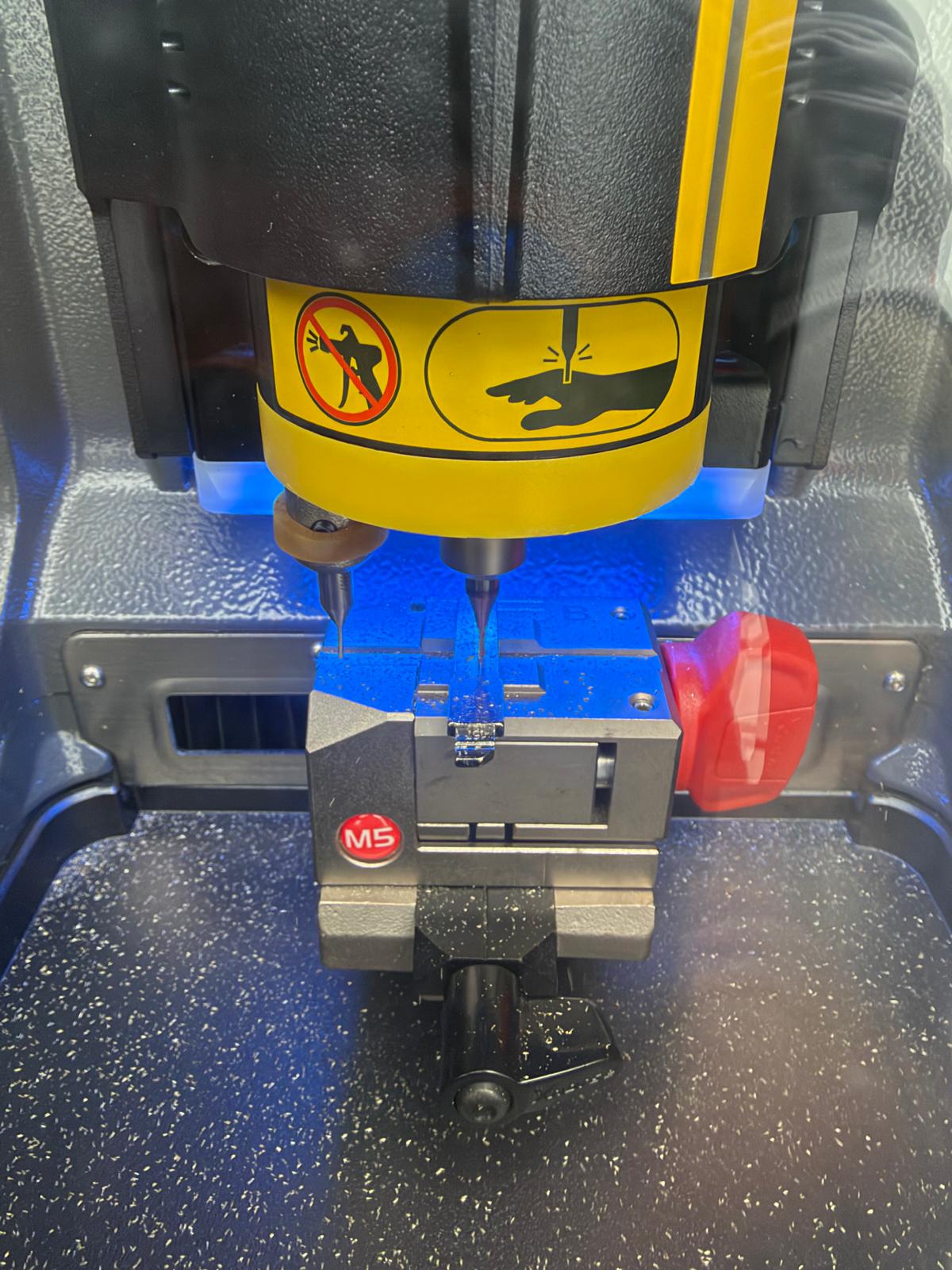 Key cutting machine cutting car key blade