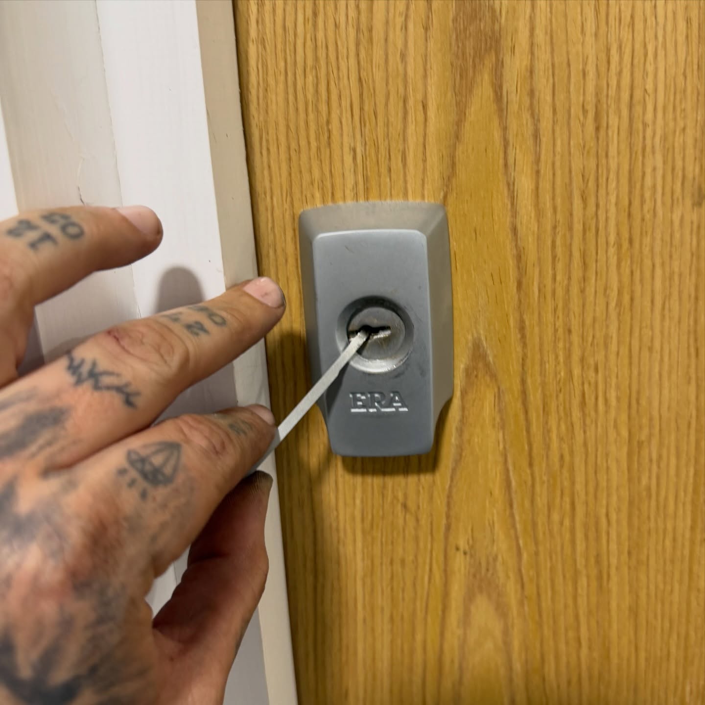 Era BS3621 nigh latch in satin silver picked open showing tension wrench