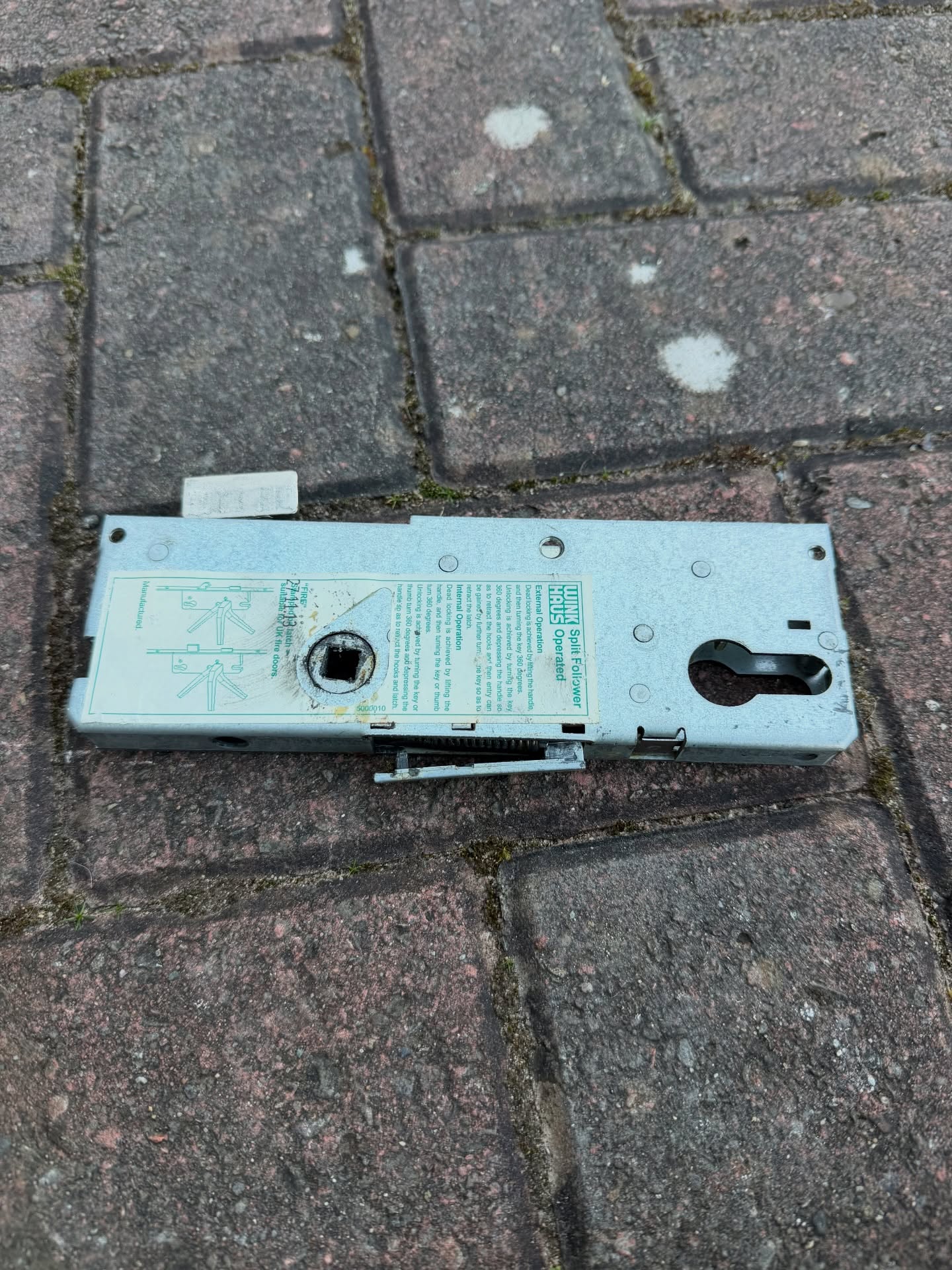 Broken gearbox from multi point lock mechanism showing snapped internal part 