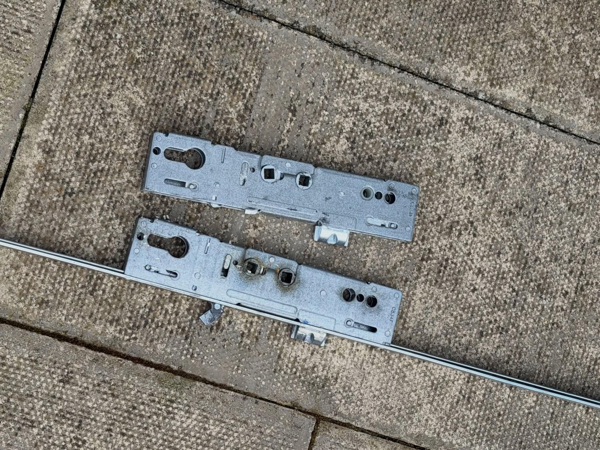 Upvc door gearboxes and multi point strip laid on flag stones during repair in Northumberland 