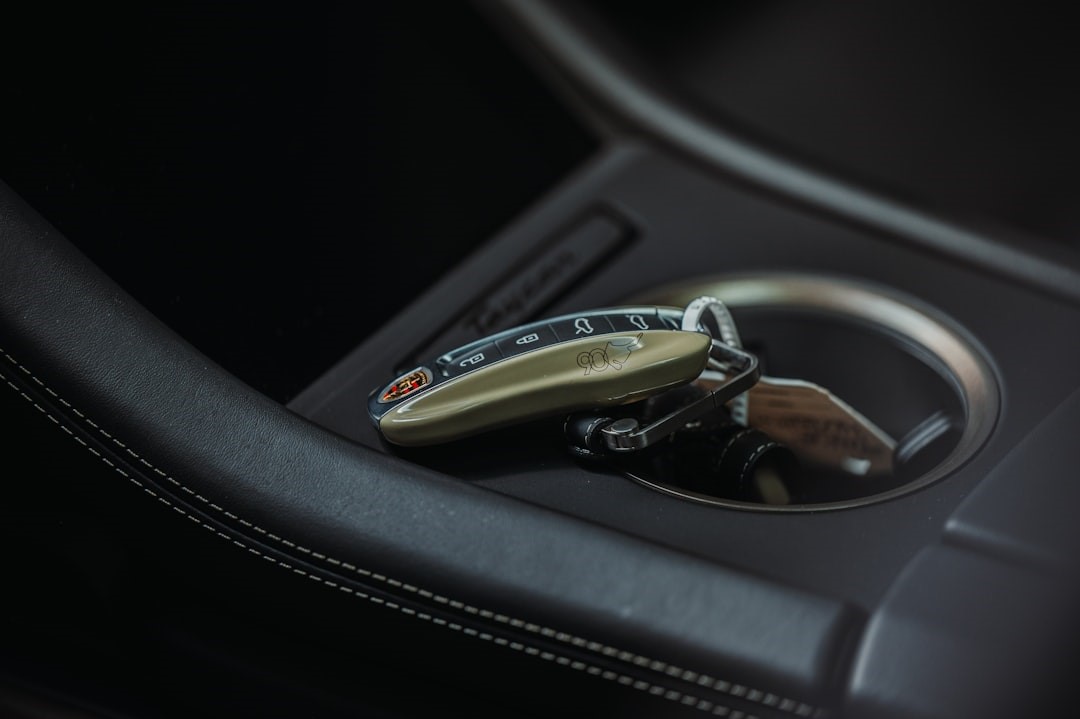 Porsche Taycan smart key laid in cup holder