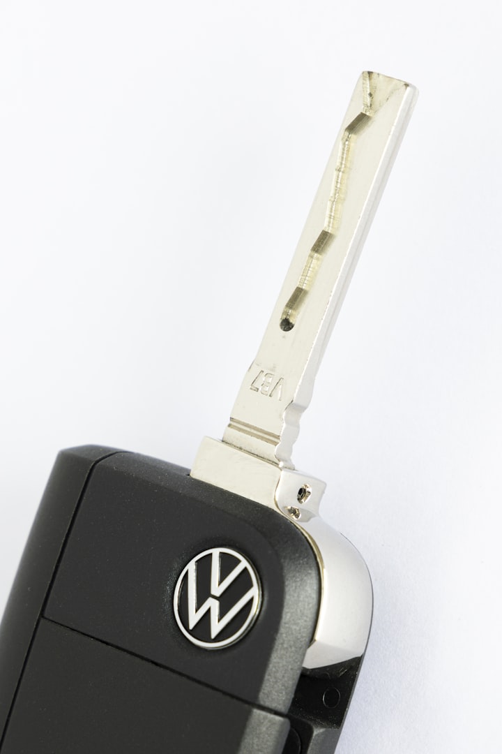 Volkswagen car key fob with flip out blade and VW logo